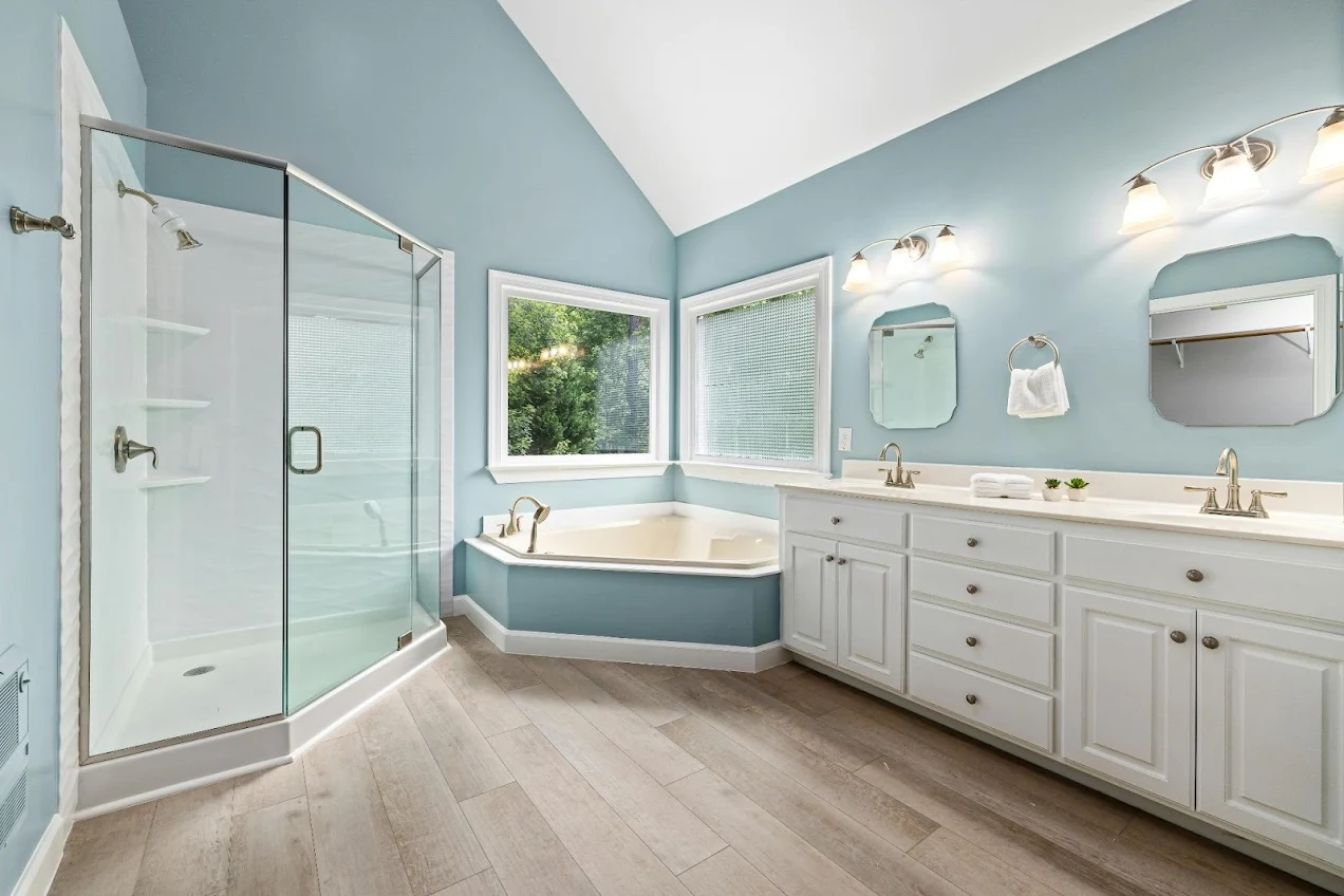a residential bathroom featuring waterproof vinyl flooring